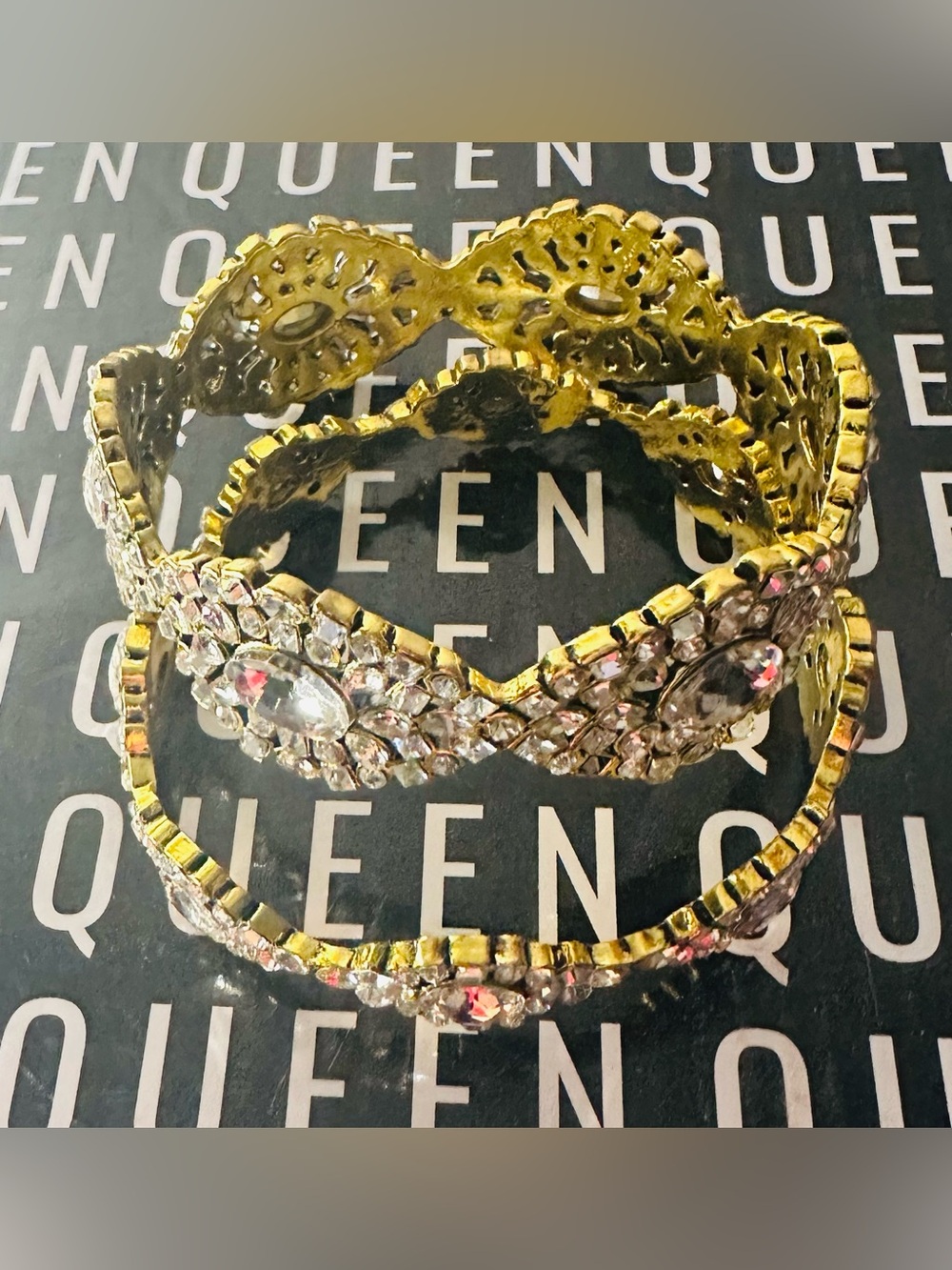 SASSY JONES gold-tone bangles feature a  design filled with clear rhinestones.